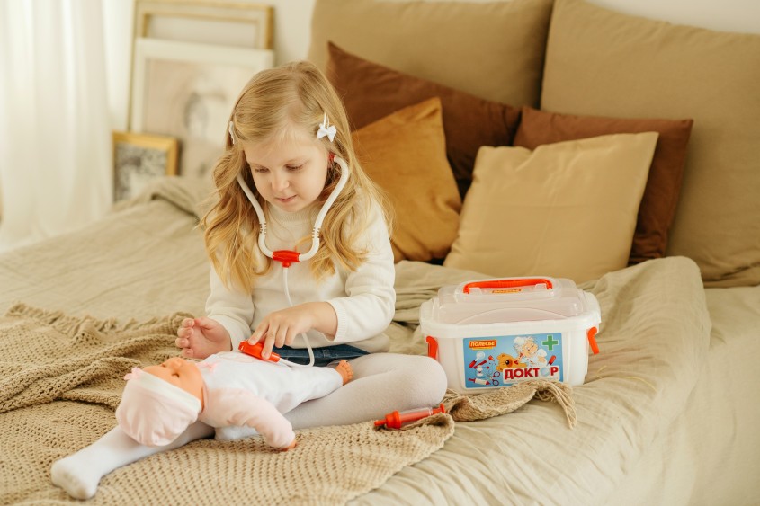Kid playing with Doctors kit