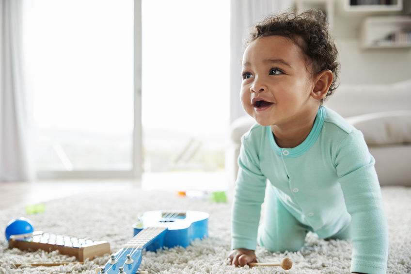 positive routines, Happy mixed race toddler boy crawling in sitting room, blog image, Positive Routines for Toddlers: Eat, Play, and Sleep (Updated for 2026)