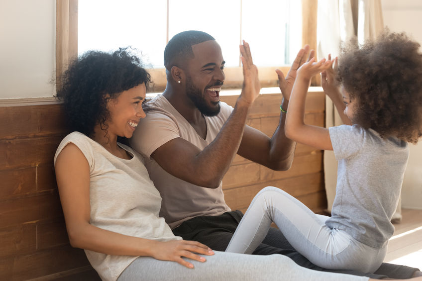 Happy biracial family with daughter have fun playing together